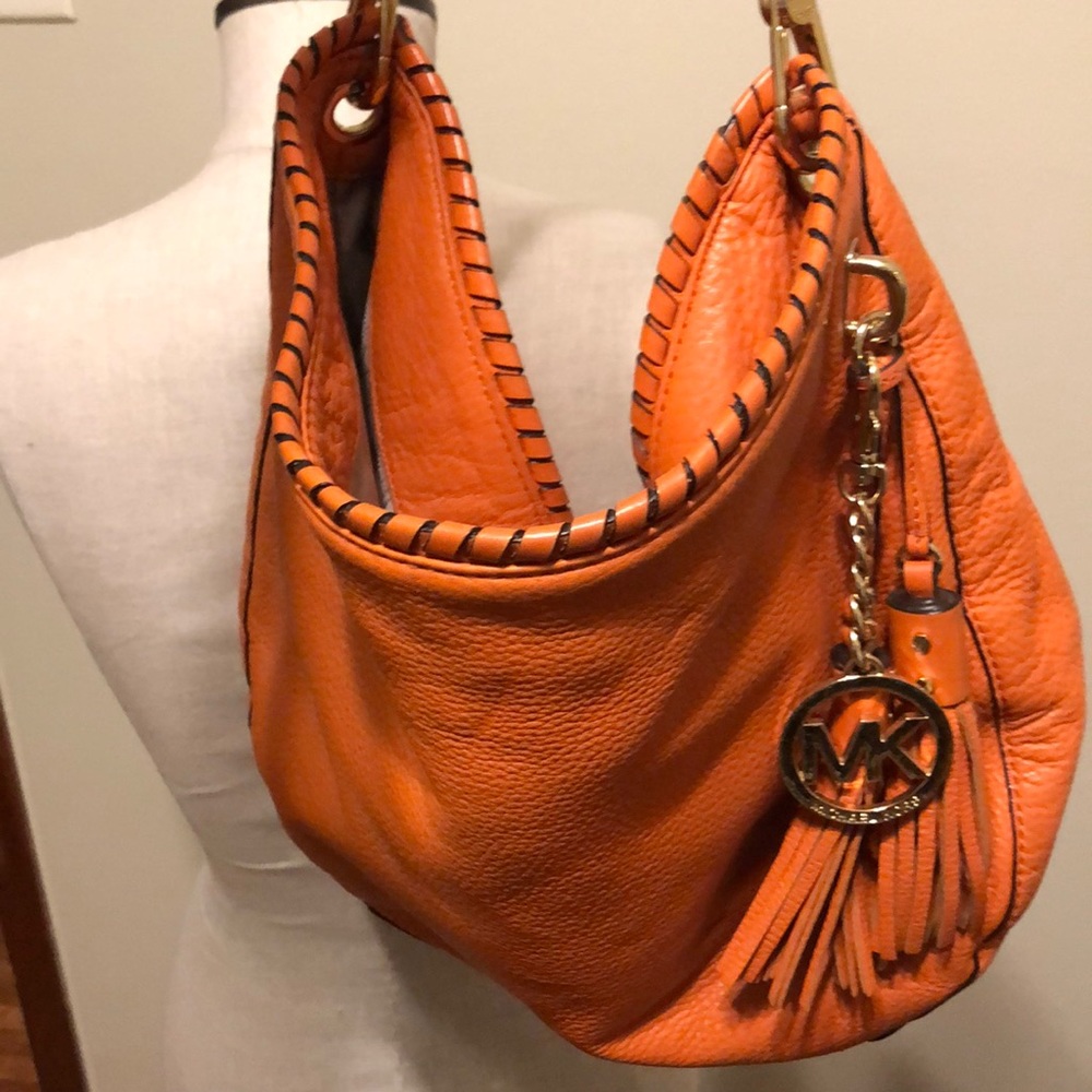 Orange Michael Kors hobo bag